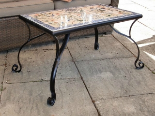 Table with mosaic tiles. Interiors.