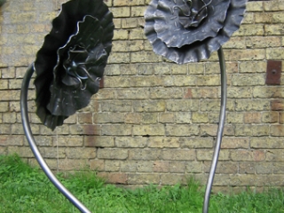 'Checker plate flower'. Garden sculpture